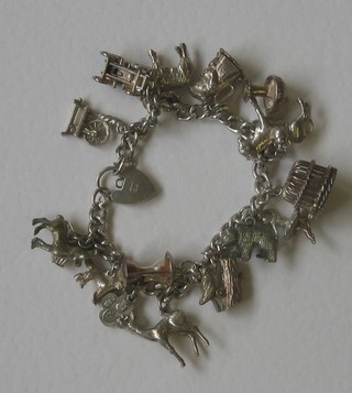 A silver curb link bracelet hung numerous charms