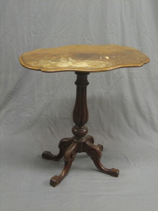A Victorian shaped walnut wine table, raised on a turned column and tripod base 27"