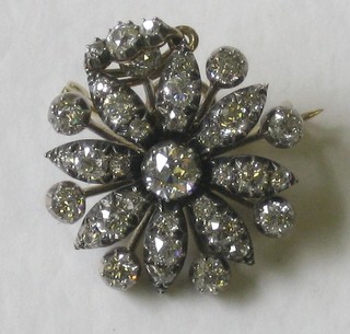 A lady's attractive Victorian floral spray brooch set numerous diamonds