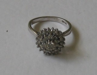 An 18ct white gold diamond cluster dress ring
