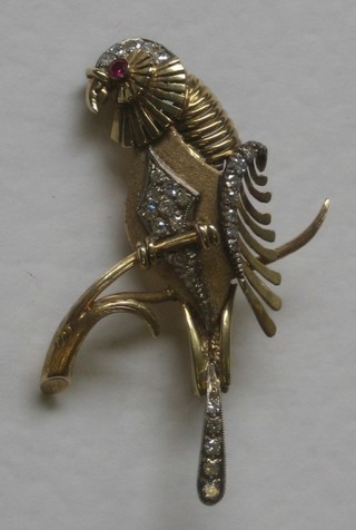 An 18ct gold gold brooch in the form of a seated bird, set diamonds