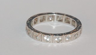 An 18ct white gold full eternity ring set white stones