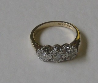 A lady's 9ct gold dress ring set 3 illusion set diamonds