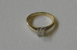 A lady's 18ct gold engagement/dress ring set a square cut diamond, approx 0.50ct
