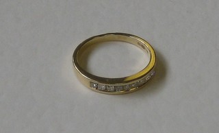 A lady's 18ct yellow gold half eternity dress ring set diamonds