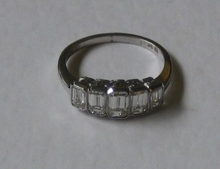 A lady's 18ct white gold engagement/dress ring set 5 rectangular cut diamonds, approx 1.50ct