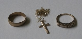 A 9ct gold wedding band, a 9ct gold dress ring set diamonds and a cross hung on a fine gold chain