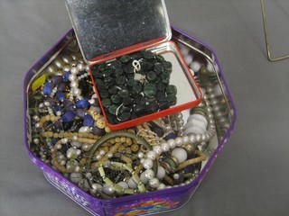 A collection of beads, costume jewellery etc