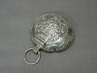 An oval embossed Eastern white metal locket with hinged lid