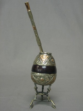 An Eastern carved nut and silver mounted Pape cup with straw