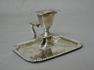 A 19th Century silver plated chamber stick with detachable sconce (no snuffer and old repair to handle)