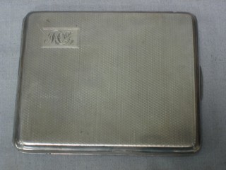 A silver cigarette case with engine turned decoration Birmingham 1936 4 ozs