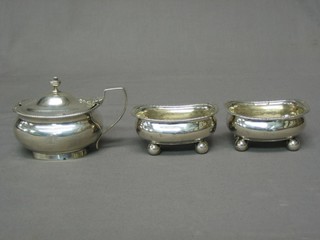 A George III silver 3 piece condiment set with mustard and 2 salts, raised on bun feet with armorial decoration, London 1806 (marks rubbed) 10 ozs