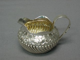 A Victorian embossed silver cream jug (marks rubbed)