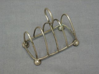 A silver 5 bar toast rack, raised on bun feet Chester 1925 1 ozs