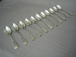 A set of 11 George III fiddle pattern silver table spoons, London 1817 24 ozs