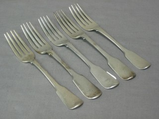 A  George III silver table fork and a harlequin set of 5 William IV silver fiddle pattern table forks