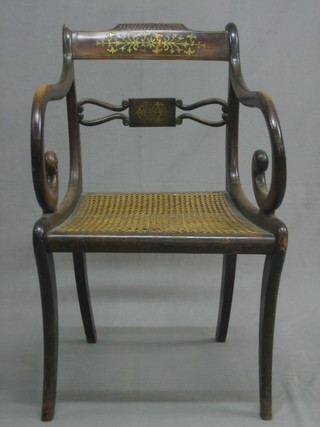 A 19th Century mahogany bar back carver chair with shaped mid rail and woven rush seat, raised on sabre supports