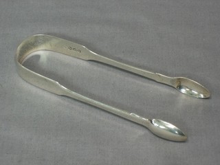 A pair of George III silver fiddle pattern sugar tongs, London 1872 1 ozs