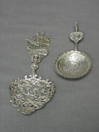 A pierced Dutch silver spoon decorated a galleon and an embossed "silver" caddy spoon (2)