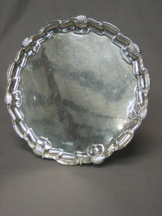 A Mappin & Webb Victorian circular silver salver with bracketed border raised on 3 scroll feet, Sheffield 1895, 26 ozs