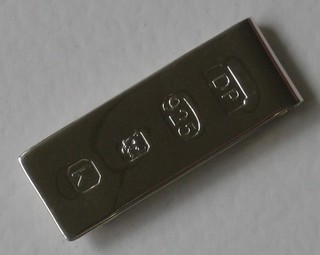 A modern silver money clip