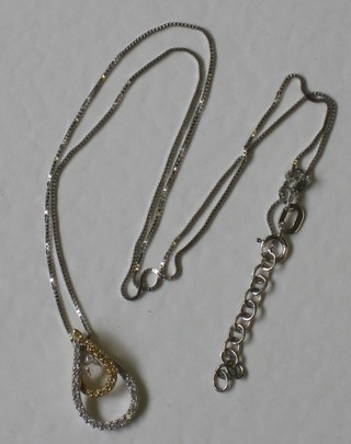 An 18ct gold tear drop shaped pendant hung on a fine gold chain