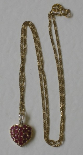 A 9ct gold heart shaped pendant set rubies