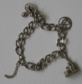 A silver curb link charm bracelet hung 3 charms