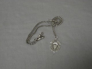 A silver double Albert curb link watch chain hung a medallion