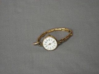 A lady's wristwatch contained in a gilt metal case