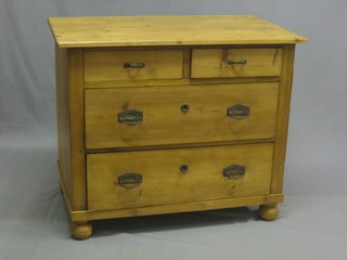 A Continental pine chest of 2 short and 2 long drawers, raised on bun feet 38" 