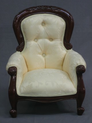 A child's Victorian style mahogany show frame chair, upholstered in yellow material and raised on cabriole supports