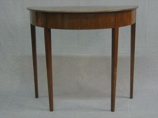 A mahogany finished demi-lune hall table 33"