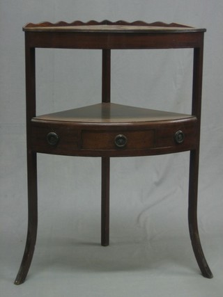 A 19th Century mahogany corner wash stand fitted 1 long drawer, raised on splayed feet 22"