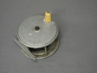 An aluminium centre pin fishing reel by The Army & Navy Stores, 4"