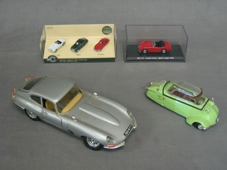 A Revell model of a Bubble Car, a Burago model Jaguar E Type, 3 model Jaguars and a model of an Austin Healey