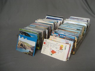 A collection of modern postcards contained in 2 plastic trays