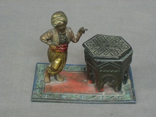 A spelter inkwell in the form of an octagonal table supported by a figure of a Blackamoor 4"