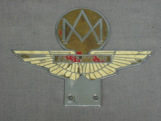 An enamelled Aston Martin owner's club radiator badge