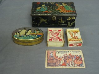 A rectangular metal Rileys toffee tin, an oval Dated Danish toffee tin and 2 sets of playing cards