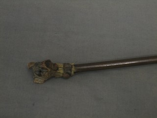A Victorian wooden cane the handle in the form of a bull dog with opening mouth, the eyes set hardstones (1 missing and ear f)