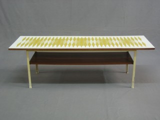 A 1950's/60's metal framed coffee table with laminate top decorated geometrical designs 45"