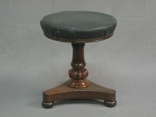 A William IV rosewood adjustable piano stool, raised on a triform base
