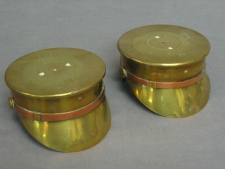 A pair of WWI Trench Art ornaments in the form of peaked caps, formed from 18lb shell cases