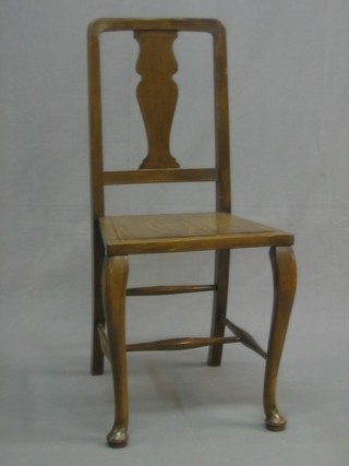 A Queen Anne style walnut bedroom chair with vase shaped splat back, raised on cabriole supports