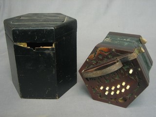 A 6 sided concertina with 21 buttons complete with carrying case