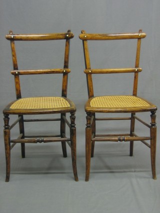 A pair of Victorian beech framed ladderback bedroom chairs with woven rush seats