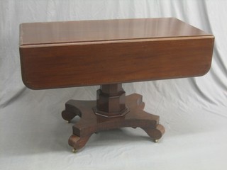 A William IV mahogany pedestal Pembroke table, raised on a chamfered column with triform base 45"
