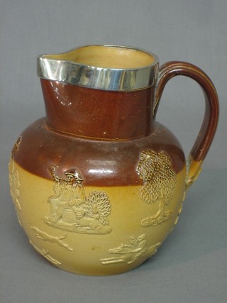 A Doulton Lambeth salt glazed jug with silver mounts 7"